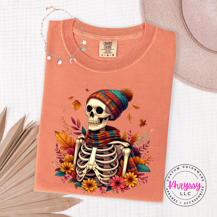 Terracotta tee with a hand-illustrated skeleton and autumn floral graphic print.