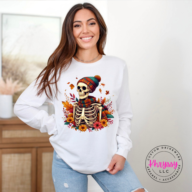 White colored tee with a hand-illustrated skeleton and floral fall design.