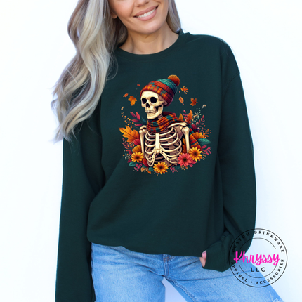 Forest colored crewneck sweatshirt featuring a scarf-wearing skeleton and florals.