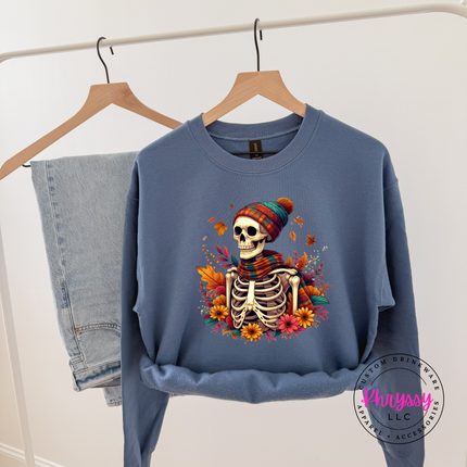 Indigo Blue crewneck sweatshirt with the spooky cozy skeleton fall graphic