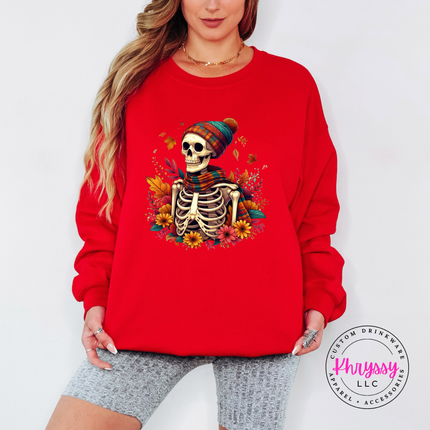 Red crewneck sweatshirt with the cozy fall skeleton in a beanie graphic