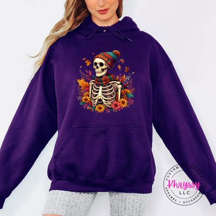 Purple hoodie with the spooky cozy skeleton fall graphic