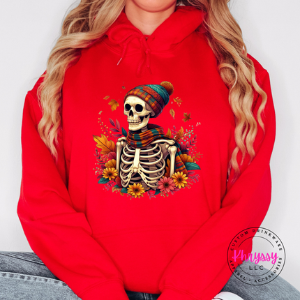 Red hoodie with the cozy fall skeleton in a beanie graphic