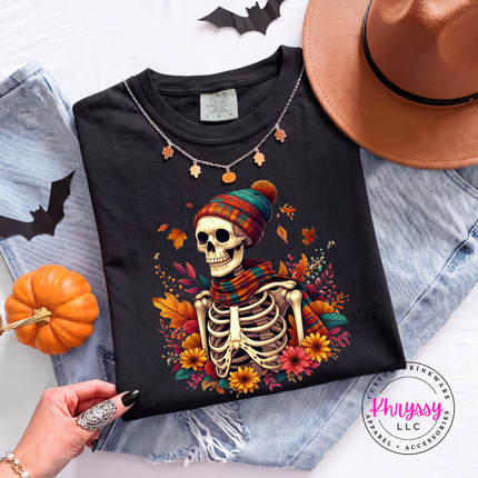 Black tee with the cozy fall skeleton in a beanie graphic