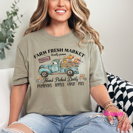 Khaki tee with the fall farmers market pumpkin truck design