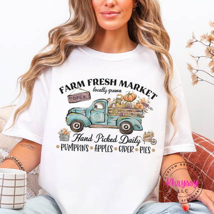 White colored tee featuring a vintage truck and autumn produce.