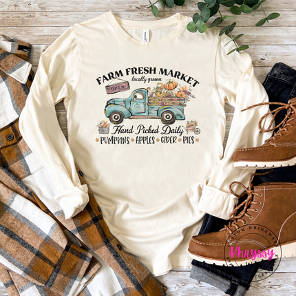 Natural long sleeve tee with the vintage farm truck with pumpkins fall graphic