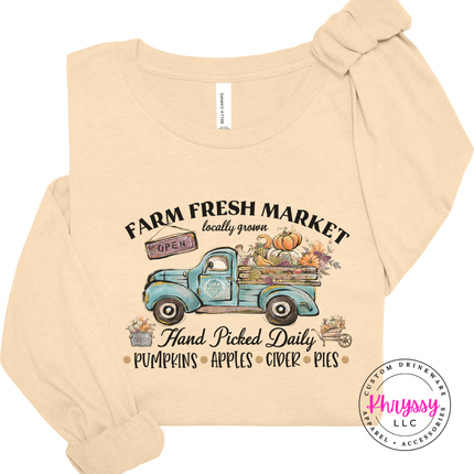 Natural tee featuring a truck loaded with pumpkins.