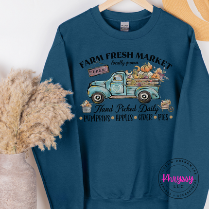 Legion blue crewneck sweatshirt featuring pumpkins and apples on a truck.