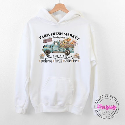 White colored pullover hoodie with a hand-illustrated market graphic.