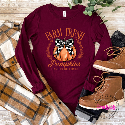 Maroon colored top with a hand-illustrated Farm Fresh Pumpkins graphic.