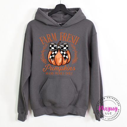Charcoal hoodie featuring a checkered bow pumpkin illustration.