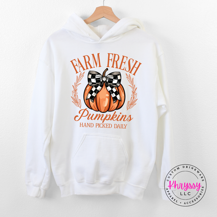 white hoodie featuring a farmhouse pumpkin and laurel design.