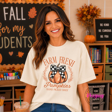 Ivory tee with the checkered bow pumpkin farm fresh design