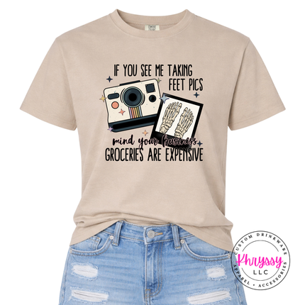 Sandstone tee with a vintage Polaroid and groceries are expensive joke