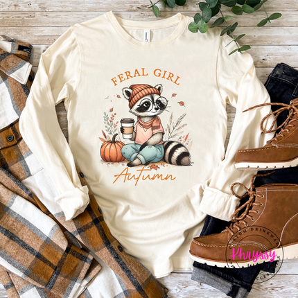 Natural tee styled with jeans, featuring a cozy raccoon design.