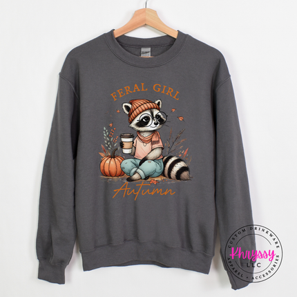 Charcoal crewneck sweatshirt with the Feral Girl Autumn raccoon graphic