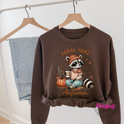 Dark chocolate crewneck sweatshirt with a funny feral girl autumn design.