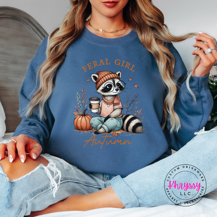 Indigo Blue crewneck sweatshirt with the funny feral girl autumn raccoon with coffee design