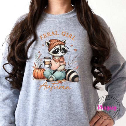 Sport grey colored crewneck sweatshirt featuring a cozy raccoon in glasses.