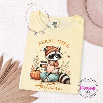 Butter tee with a hand-illustrated feral girl autumn raccoon print.