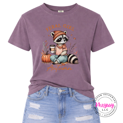 Wine graphic tee featuring a cozy raccoon in glasses and a scarf.