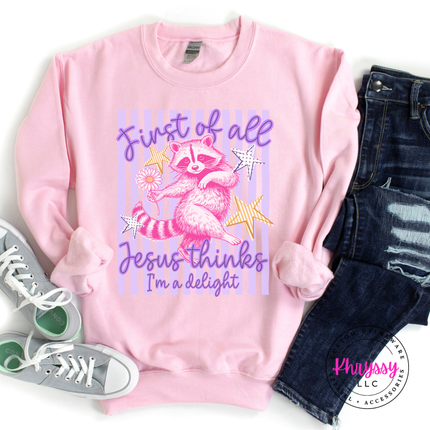 Pink sweatshirt with raccoon graphic and text, paired with jeans and sneakers on a white background.