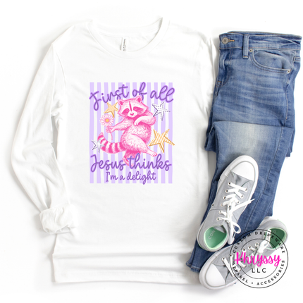 White long-sleeve shirt with a raccoon graphic and text, paired with blue jeans and white sneakers on a white background.
