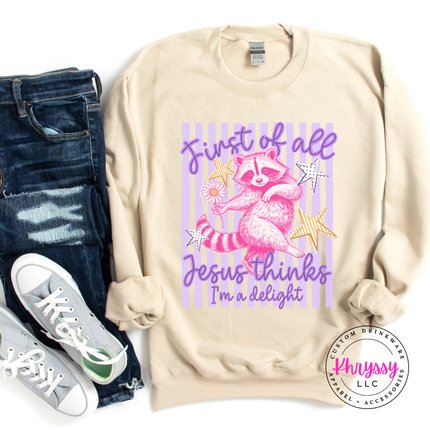 sand sweatshirt with a raccoon graphic and text, paired with jeans and sneakers on a white background.
