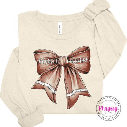 Heather Natural long sleeve with a cute football bow game day graphic.