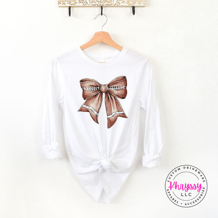 White long sleeve tee with a brown football-shaped lace bow graphic.