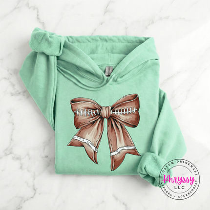 Mint hoodie with a cute football bow game day graphic.