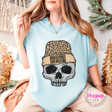 Close up of the Freezing To Death beanie patch on a Chambray tee.