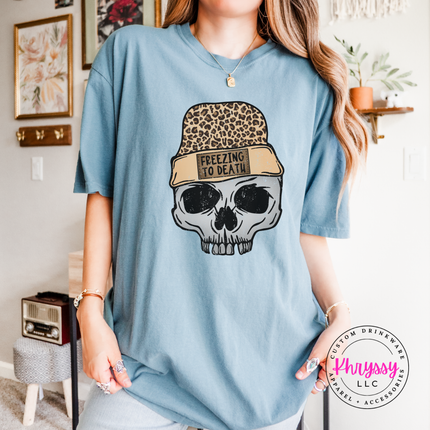 Freezing To Death skull and leopard beanie design on an Ice Blue tee.