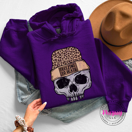 Woman wearing the Freezing To Death skull hoodie in Purple.