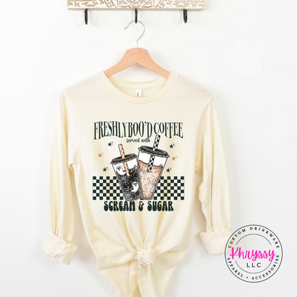 
Heather Natural long sleeve featuring a spooky checkerboard latte design.
