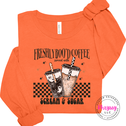 Orange long sleeve tee with the Freshly Boo'd Coffee scream and sugar graphic