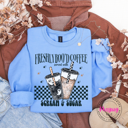 Carolina Blue crewneck sweatshirt with the ghost iced coffee Halloween design