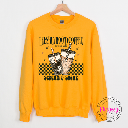 Gold heavyweight crewneck featuring a spooky checkerboard latte design.
