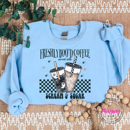 Light Blue crewneck sweatshirt styled for fall with a Halloween coffee print.