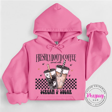 Cozy Azalea fleece hoodie featuring a spooky checkerboard latte design.