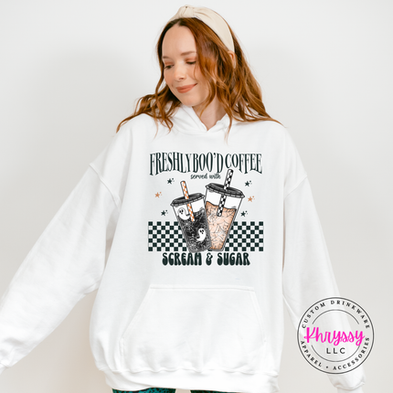 White fleece hoodie with drawstring hood and a fun Scream and Sugar design.
