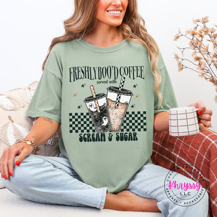 Woman wearing a Bay tee with the Freshly Boo'd Coffee scream and sugar graphic