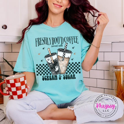 Soft Chalky Mint pigment-dyed tee featuring a spooky checkerboard latte design.