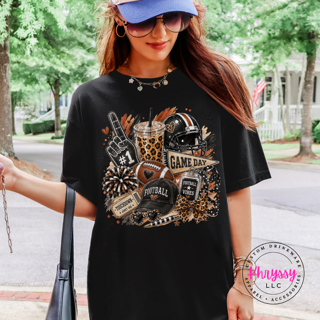Woman wearing a Comfort Colors tee with bold Game Day leopard football collage graphic