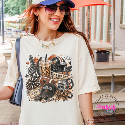 Ivory tee with the game day helmet and leopard cup graphic