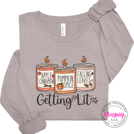 Heather pink gravel tee featuring three fall candles and script text.