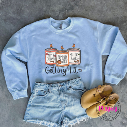 Light Blue crewneck sweatshirt with the cozy fall candles script graphic