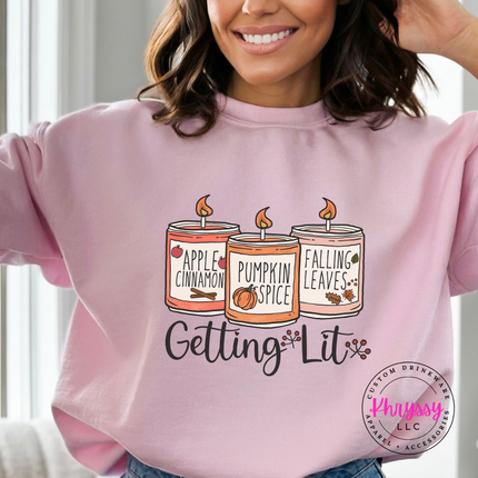 Light Pink crewneck sweatshirt with the Getting Lit fall candles graphic