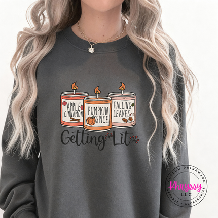 Charcoal crewneck sweatshirt with a playful fall candle illustration.